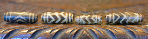PUM 2   A Group of 4 Antique Pumtek Beads