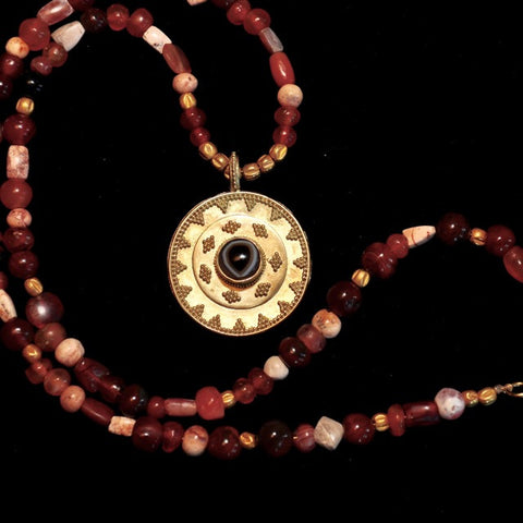 AS 112 Strand of Ancient Patinized Carnelian with 18K Etruscan Style Pendant